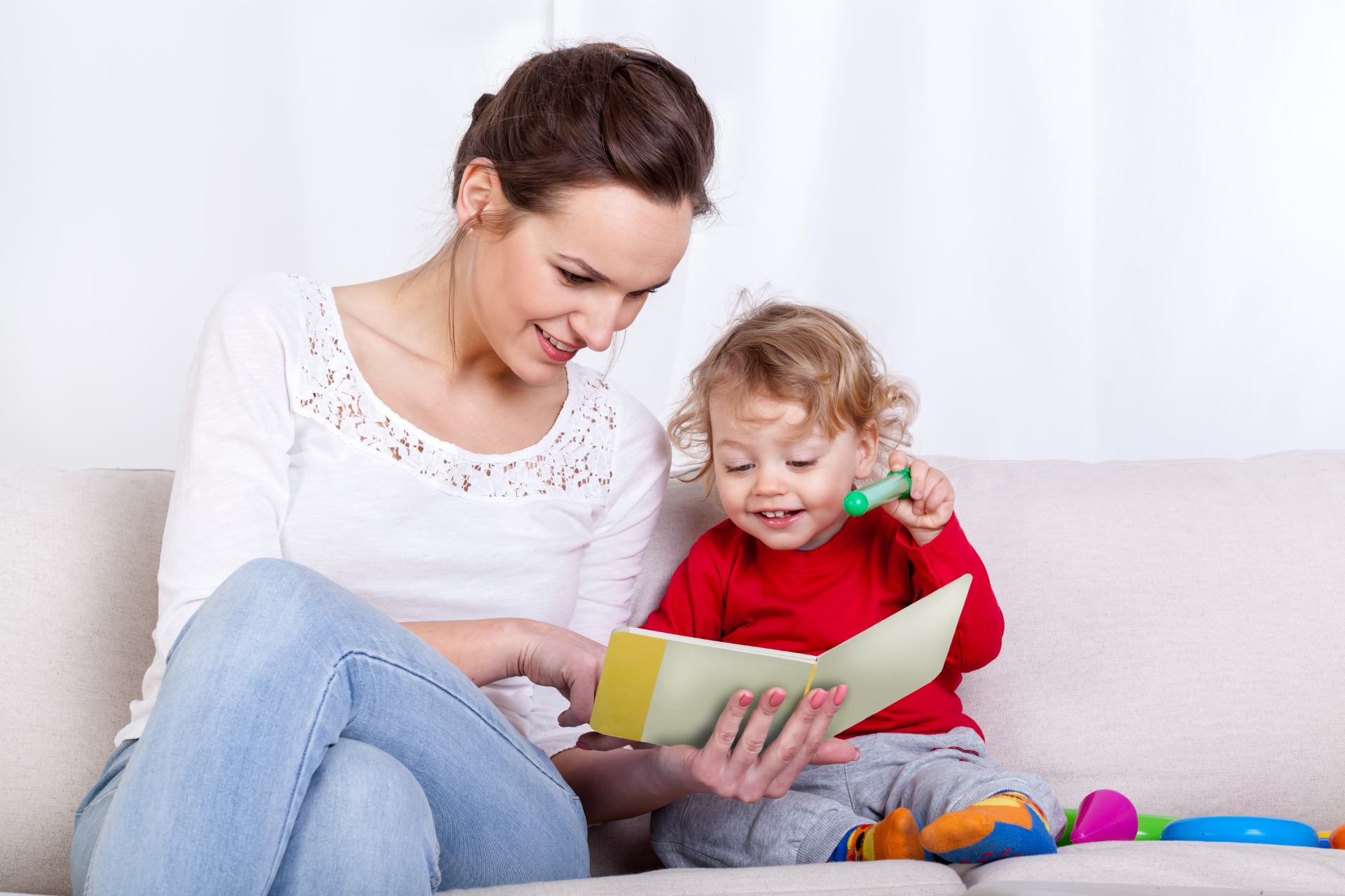 Child reading with woman