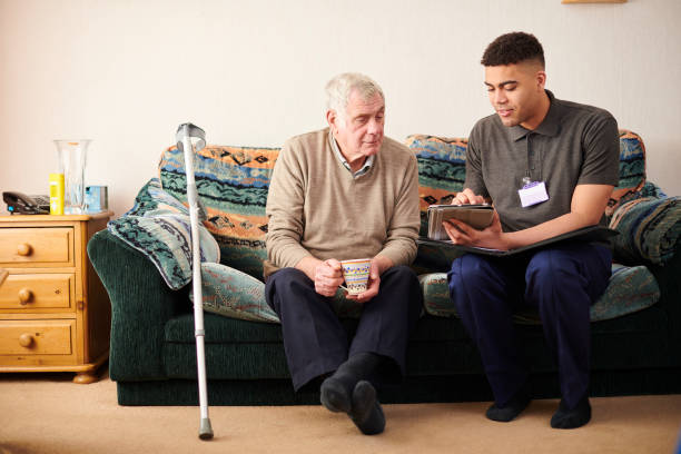 older man sat with young carer