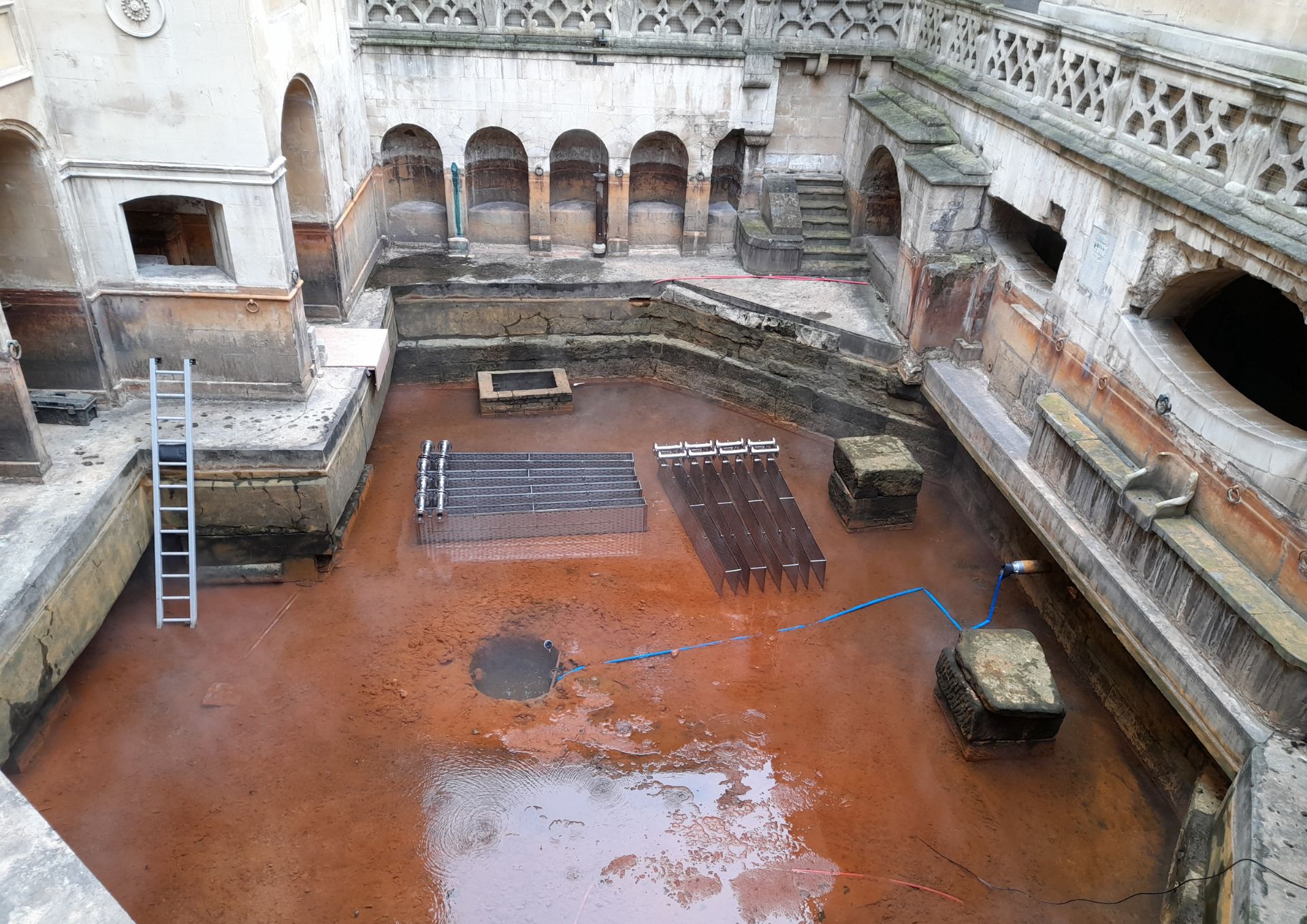 Photo of the drained Roman Baths showing installation of heat system