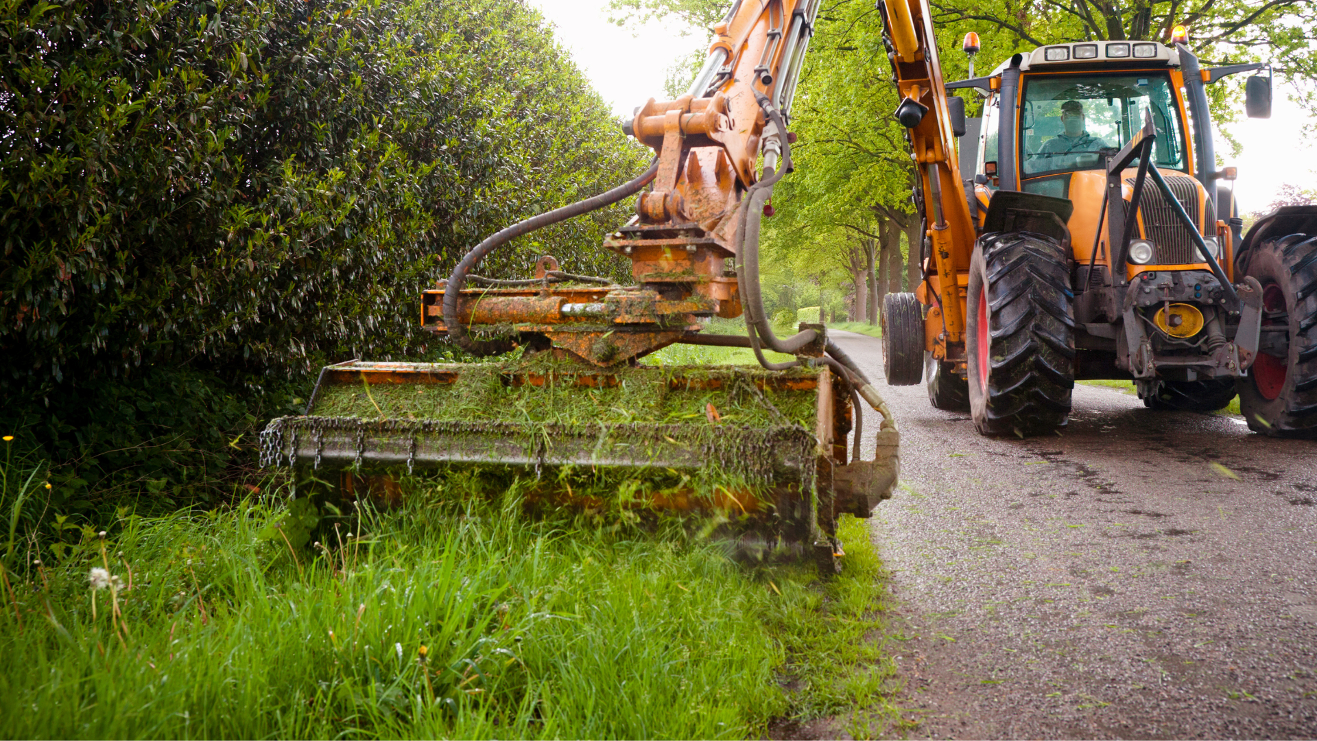 A tractor cutting a grass verge