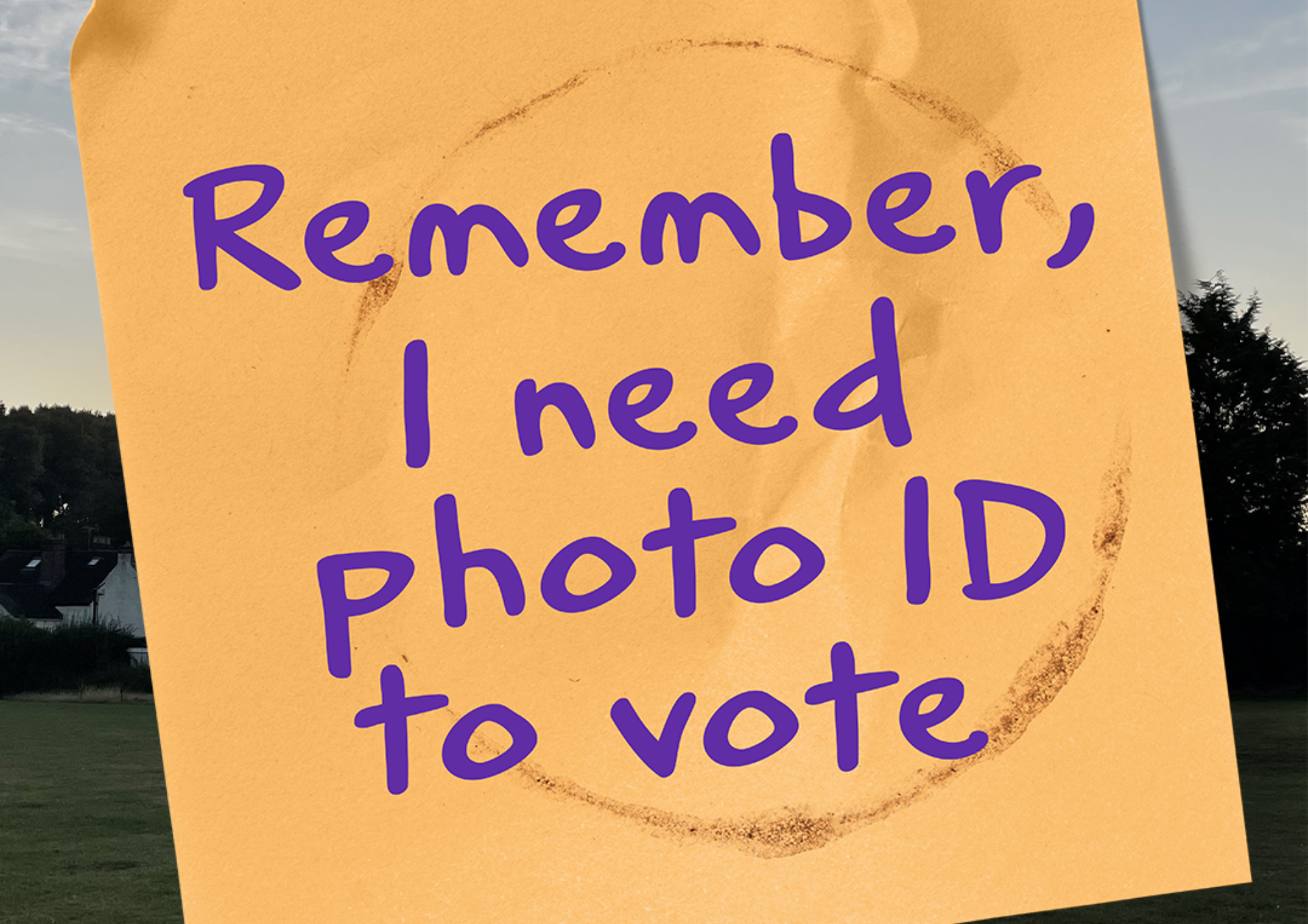 Post it note with writing saying: You now need photo ID to vote at a polling station