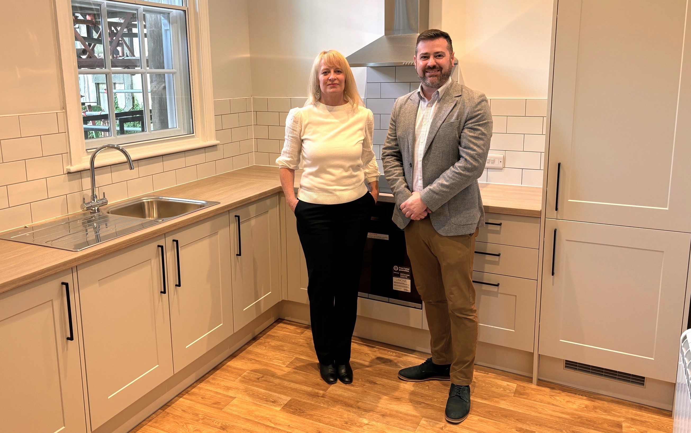 Pictured left to right are Sally Higham and Councillor Kevin Guy in a newly fitted kitchen at a social housing flat in Bath