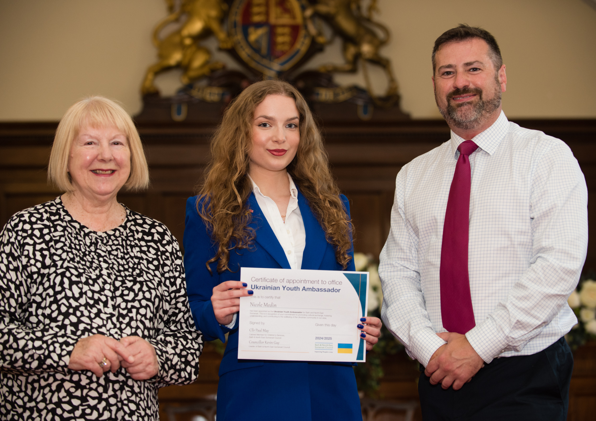 Marian McNeir MBE, Nicole Medin and Councillor Kevin Guy. Nicole is holding a certificate