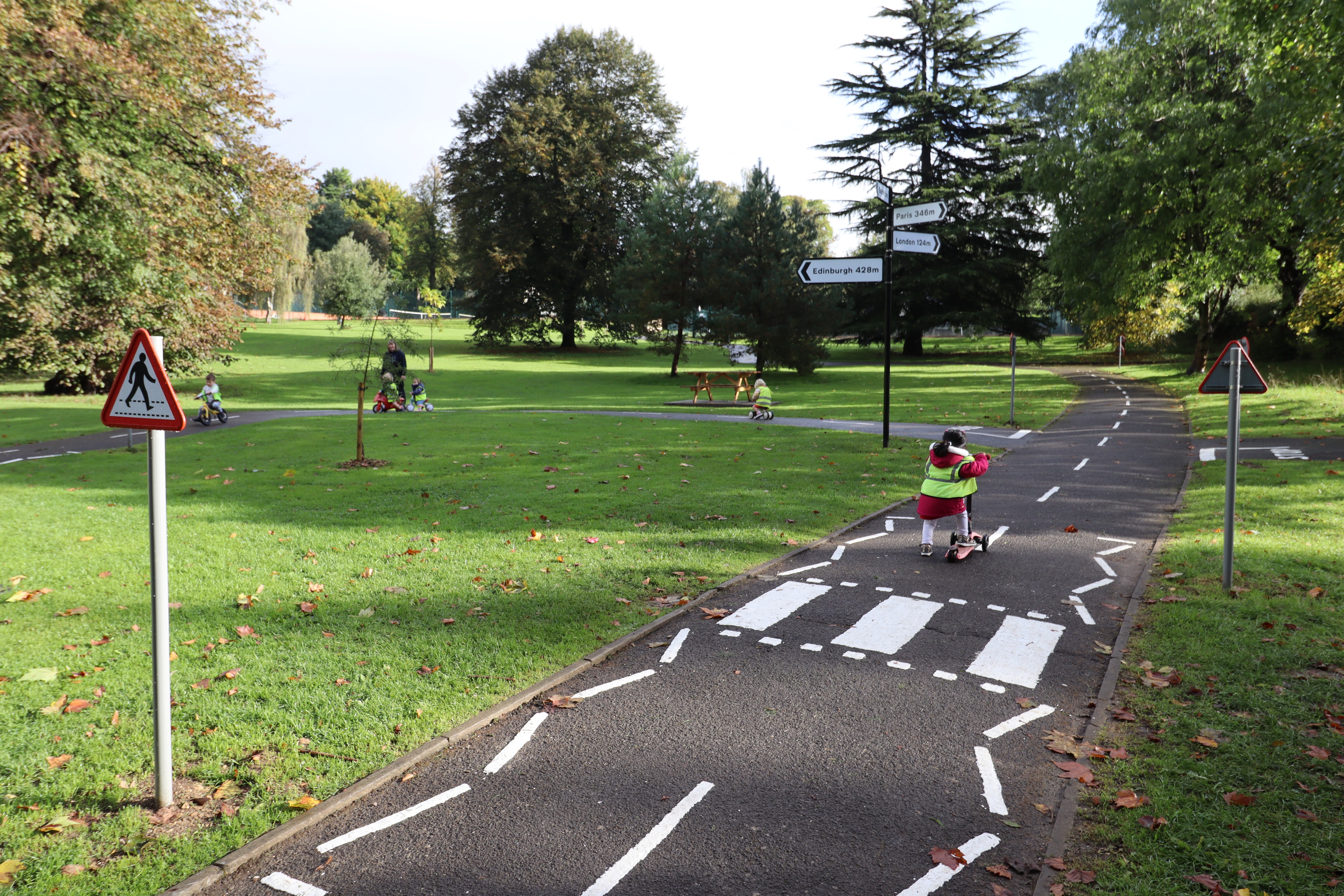 Children playing on the Alice Park cycleway in Bath. 