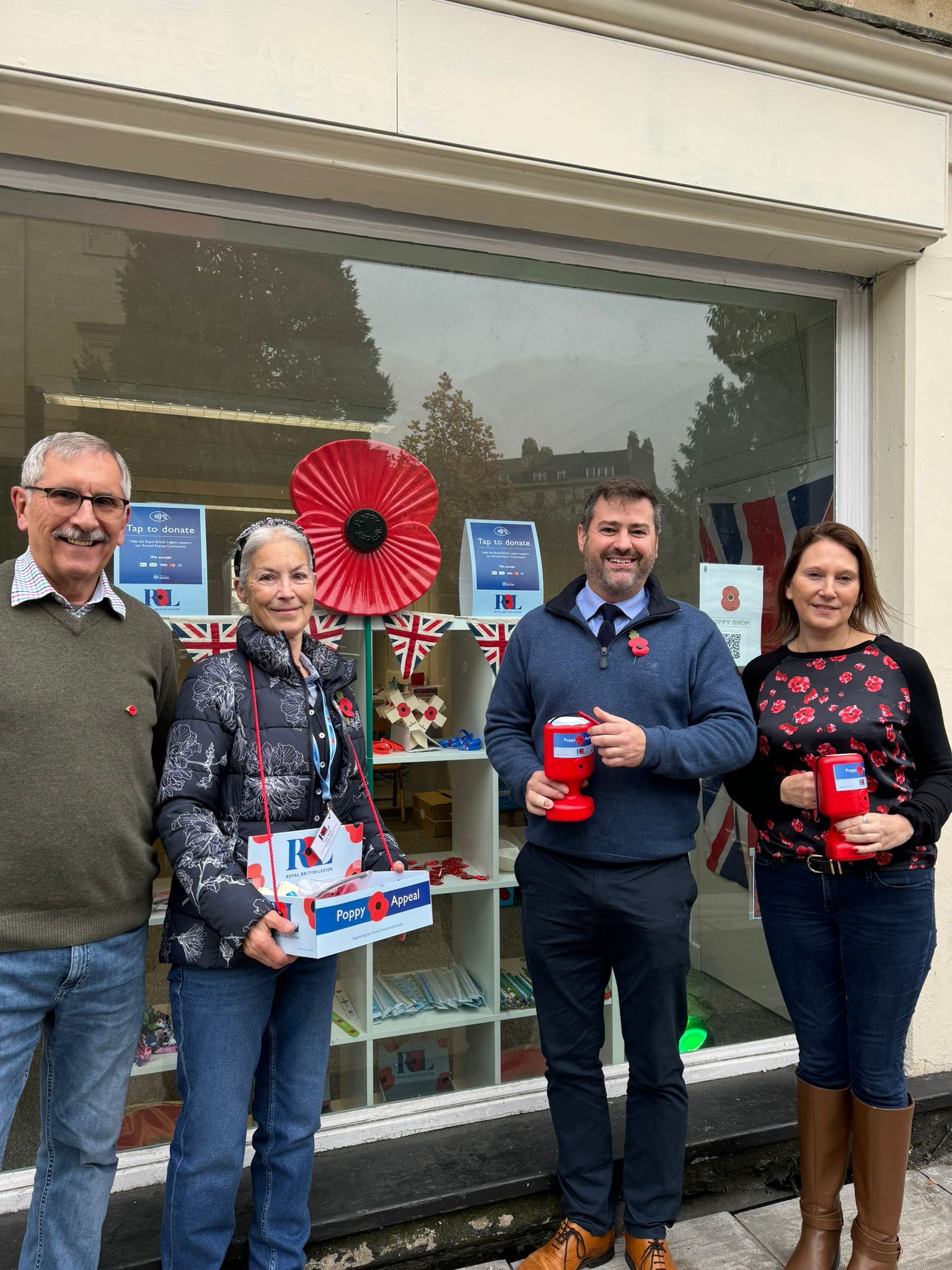 Cllr Kevin Guy with Poppy seller volunteers