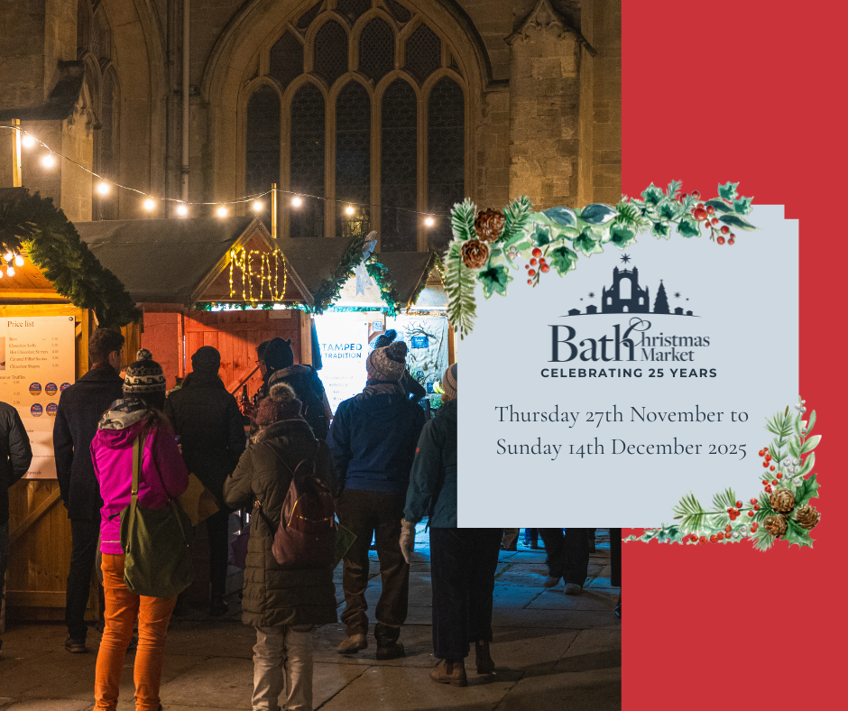 People stand by Bath Abbey at Bath Christmas Market