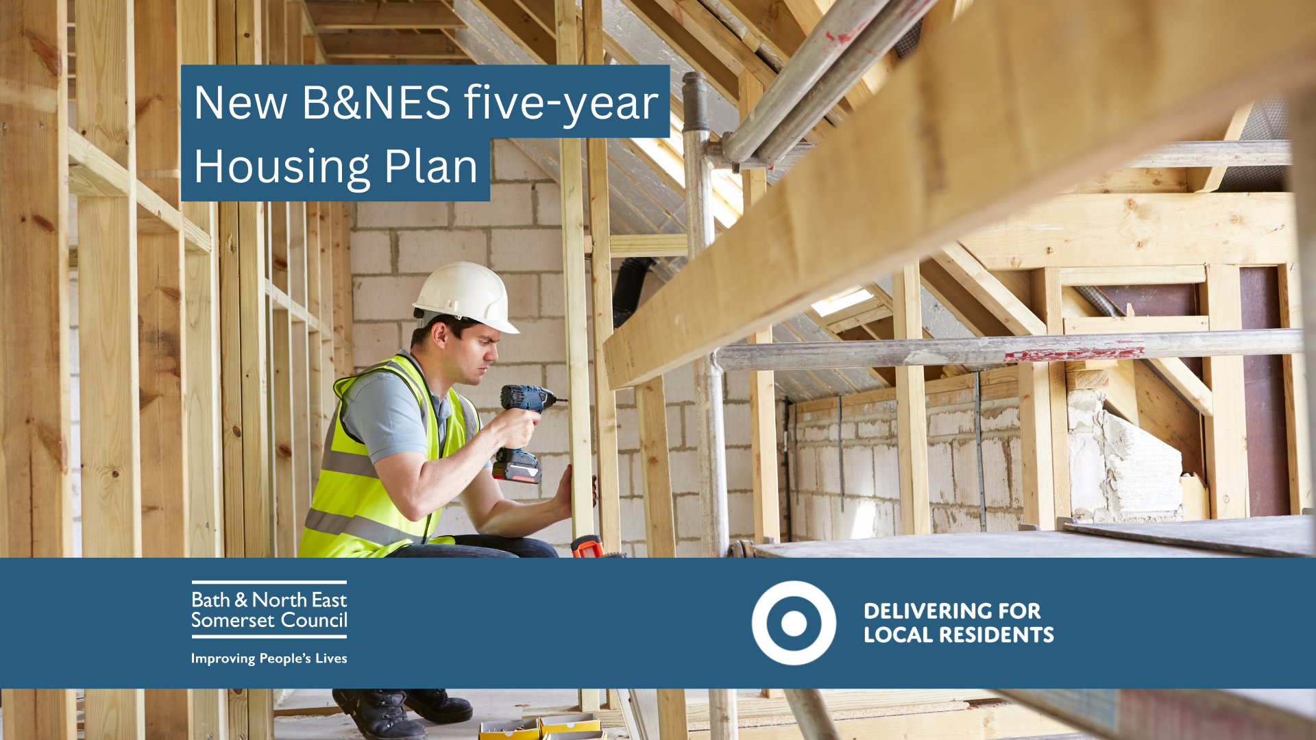 image shows a man in a hard hat and hi viz working on roof timbers in a new-build house 