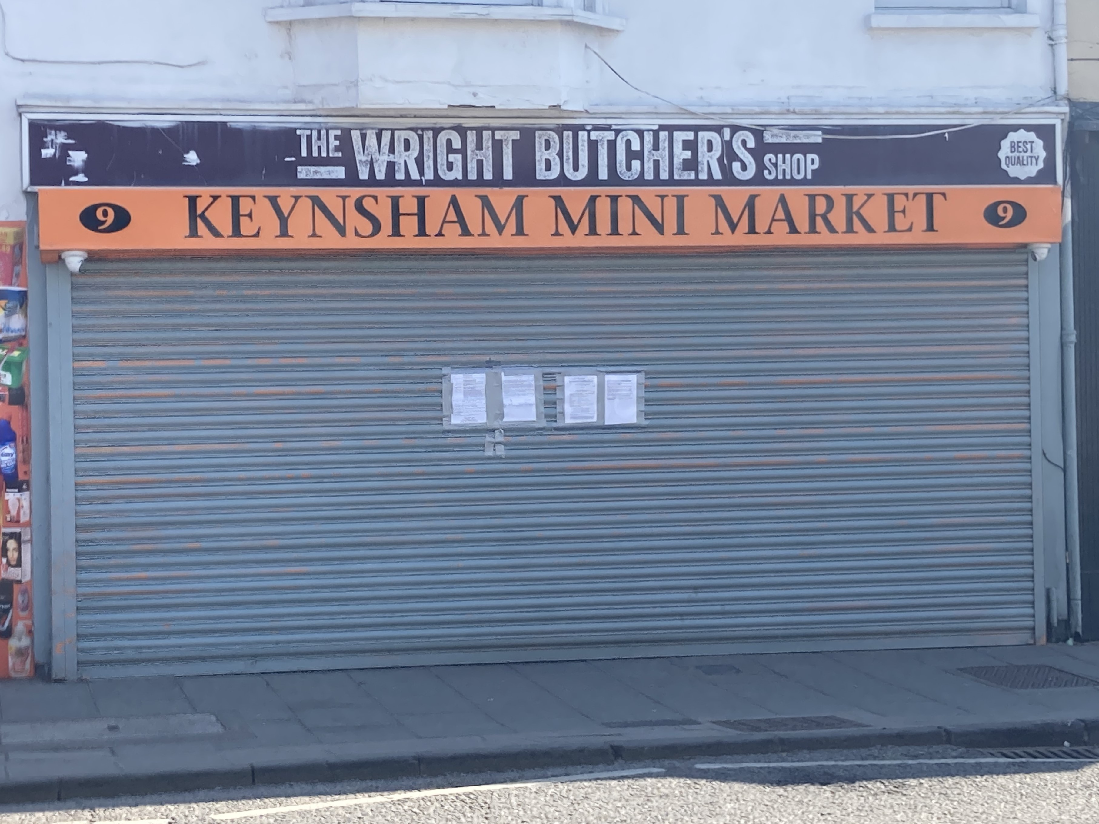 Keynsham Mini Market in Keynsham High Street with shutters down and closure order on the shutters