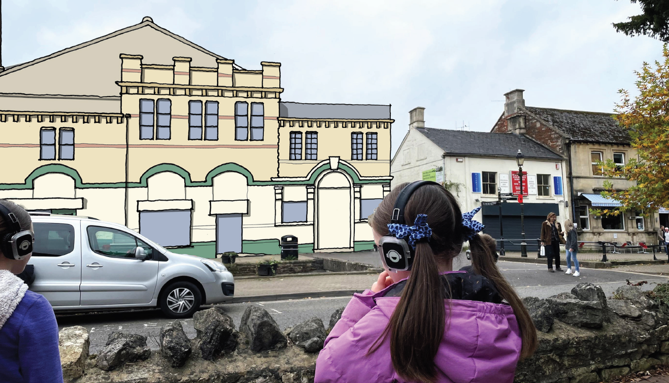 Children look at a building in Midsomer Norton high street