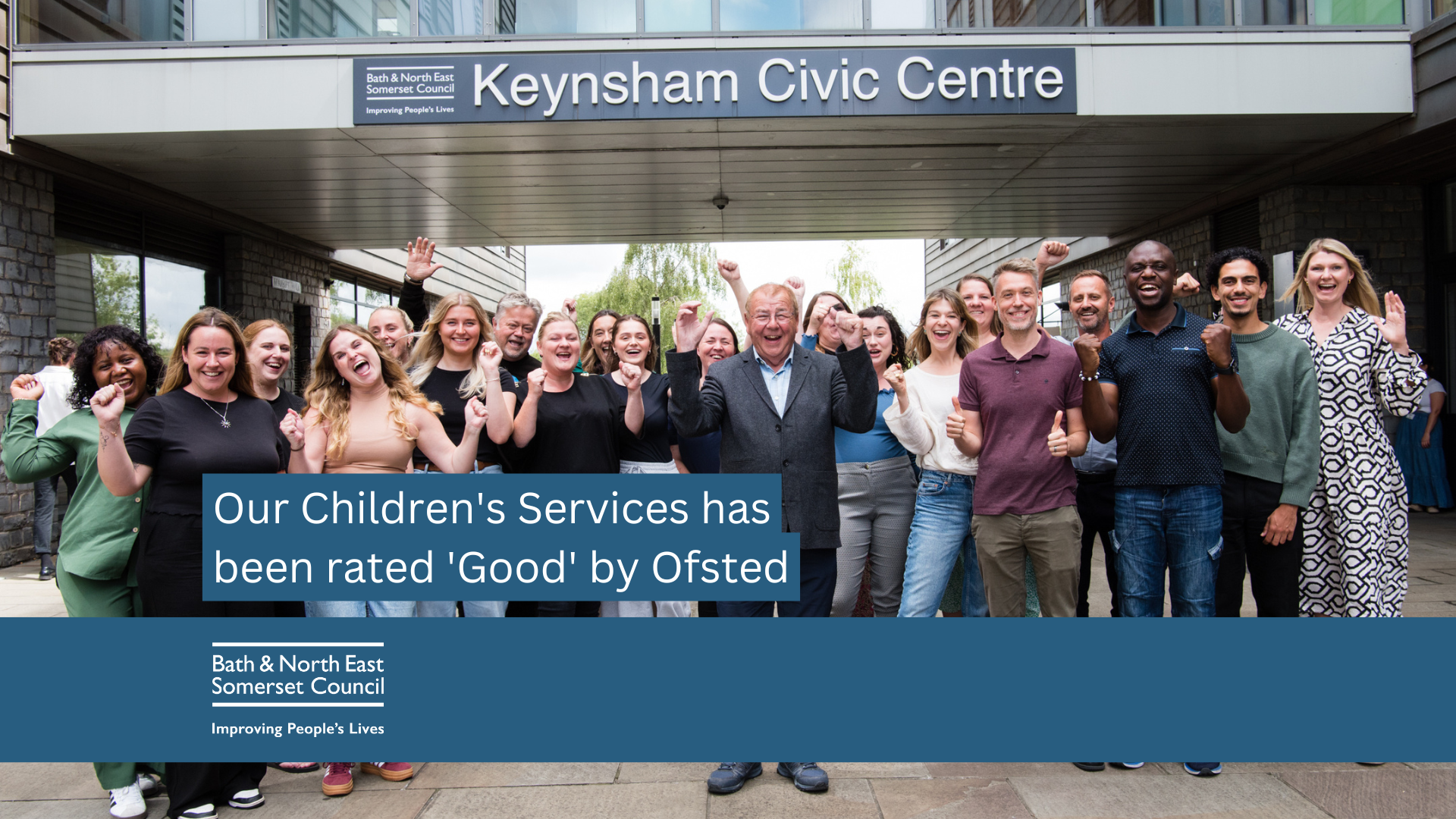 Group of people cheer outside Keynsham Civic Centre
