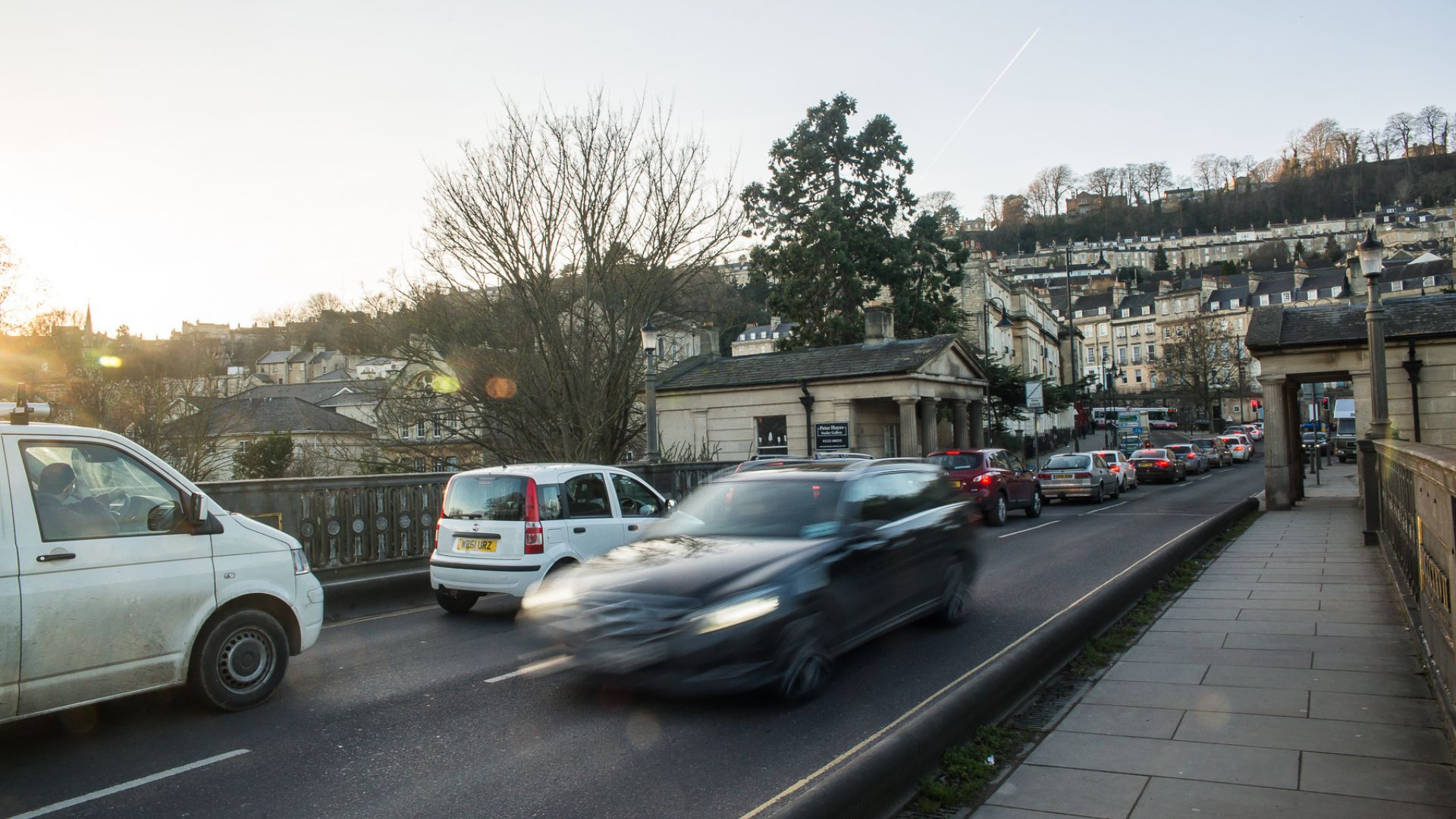 Cars passing over Cleveland Bridge in Bath. 