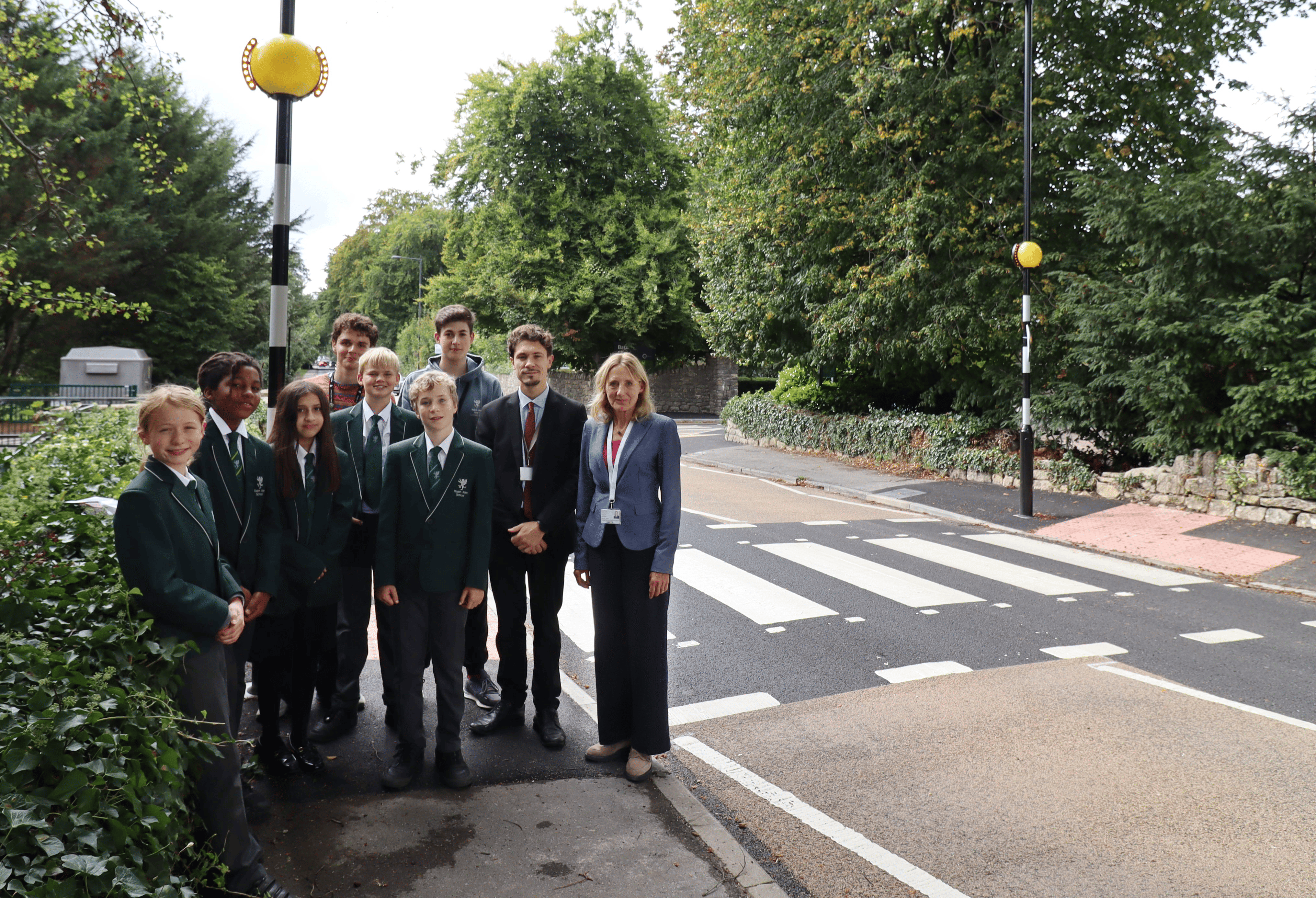 Councillor Lucy Hodge with deputy head Seb Witts and children from Ralph Allen School