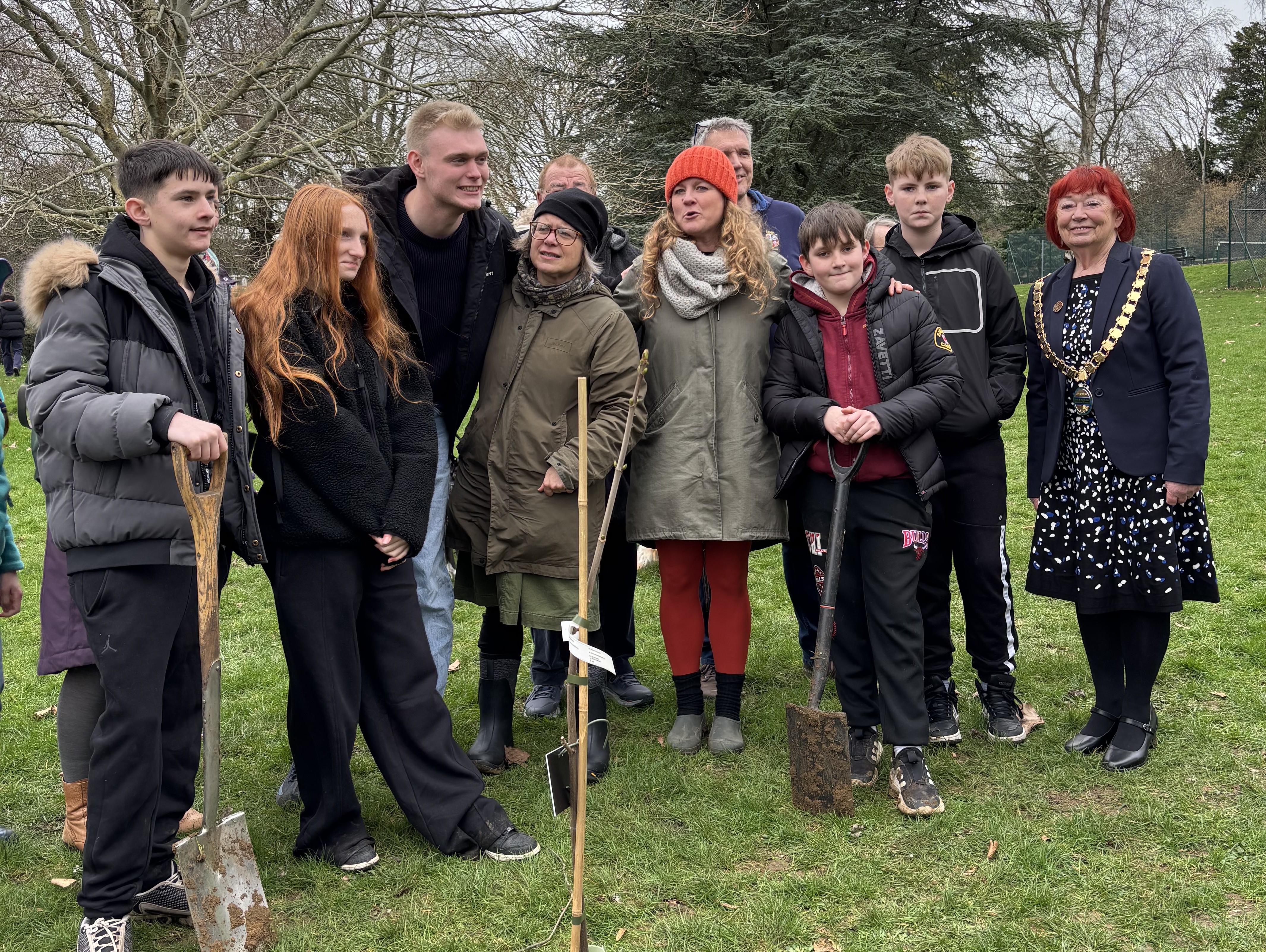 pictured are group of young people and community leaders planting the Sycamore Gap sapling in Alice Park Bath