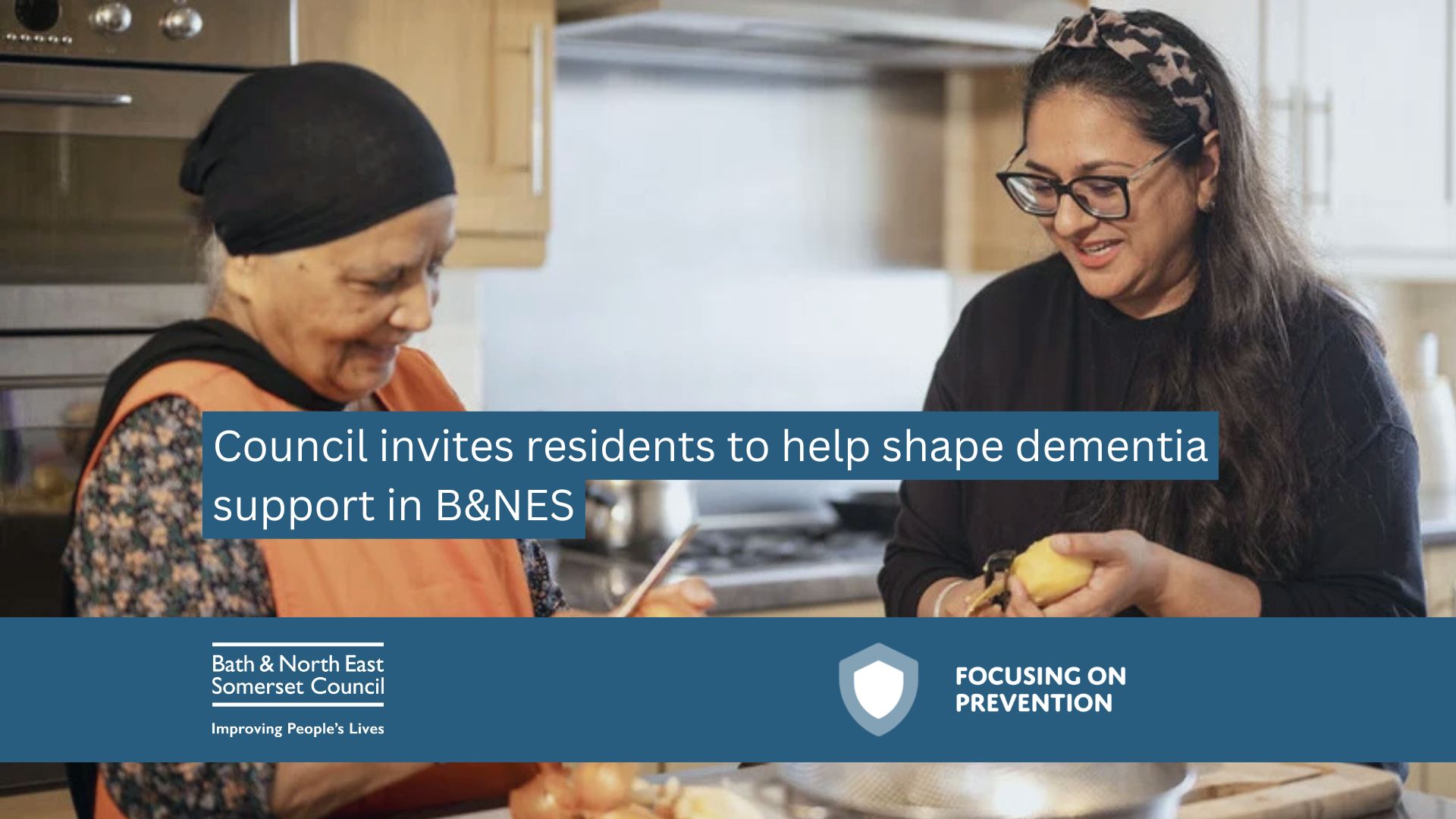 Two people talking in a kitchen.