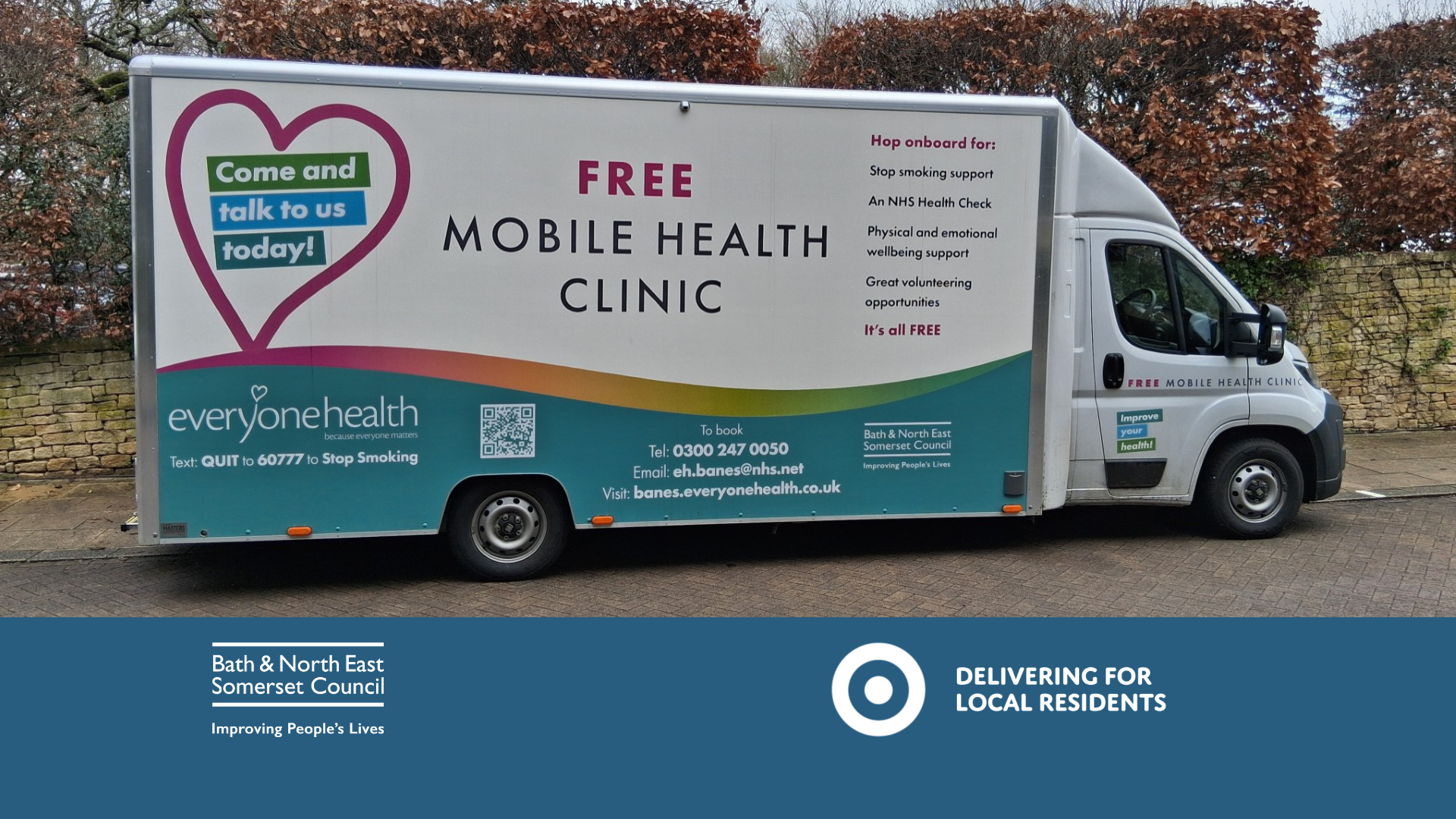 a mobile wellness van with logos and writing on the side