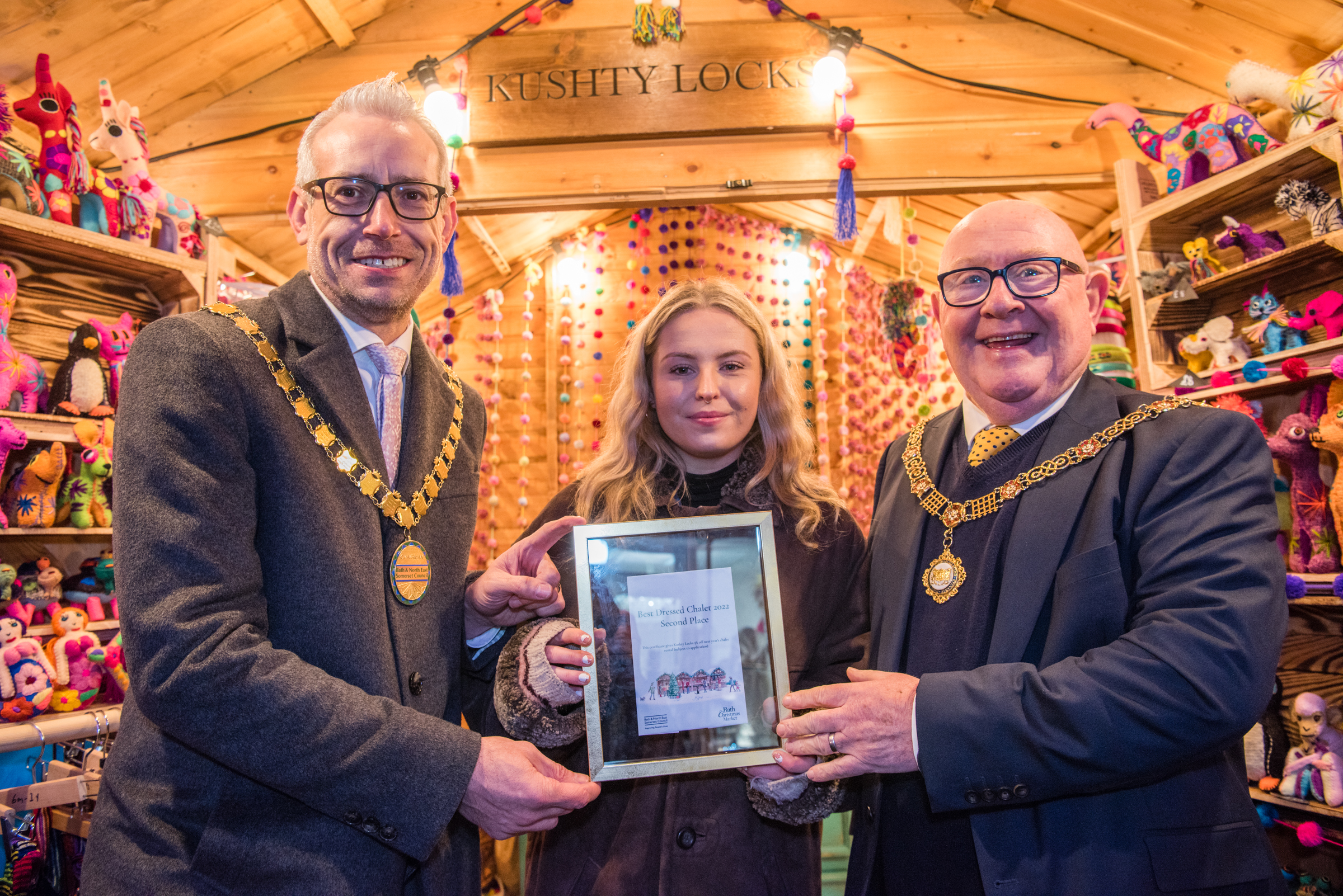 From left to right: council Chair, Shaun Stephenson-McGall, Louise Watson from Kushty Locks and The Right Worshipful Mayor of Bath, Councillor Rob Appleyard inside the Kushty Locks chalet.